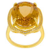 Oval yellow citrine sterling silver ring with accent gems, showcasing luxury and elegance.